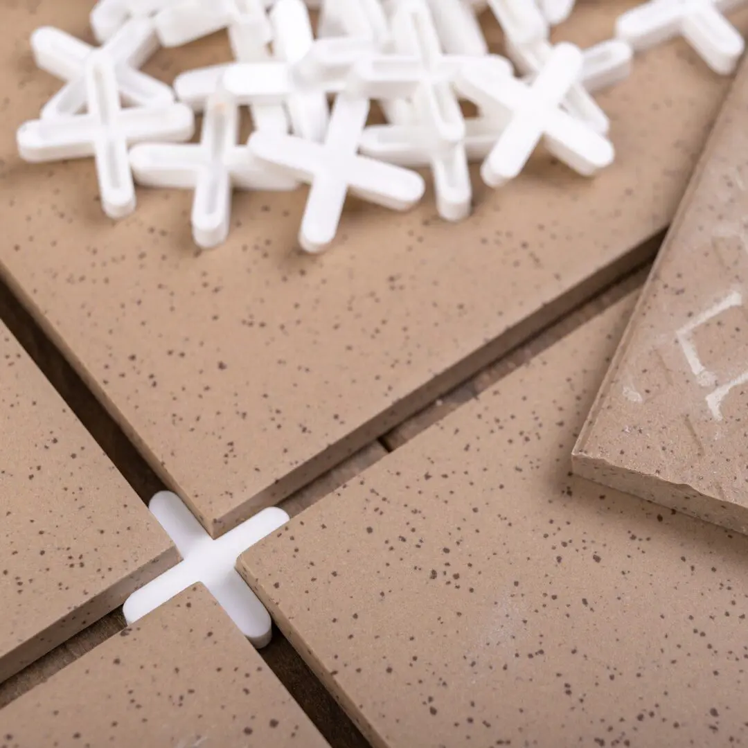 Tiles with spacers for installation