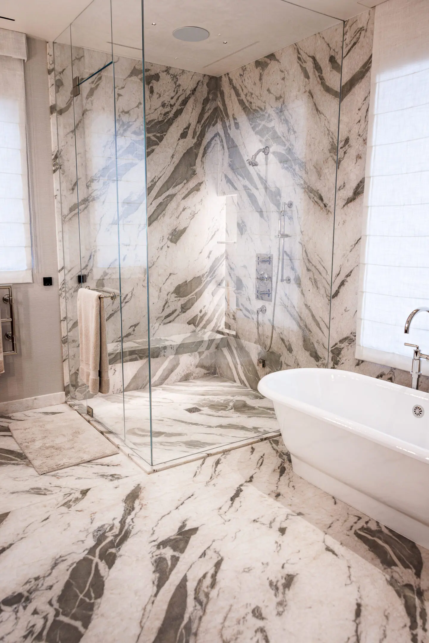 Luxurious marble bathroom with freestanding tub